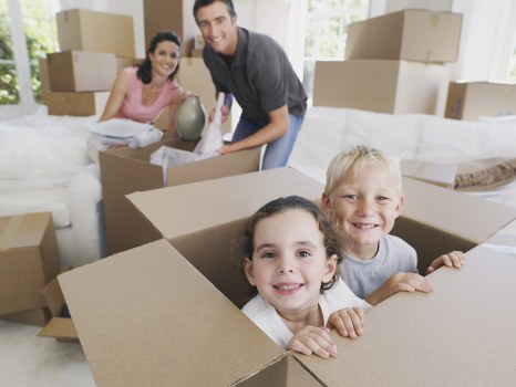 Professional movers carrying furniture during a Sutton relocation