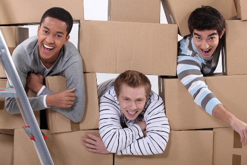 Careful loading of furniture into a moving van for Sutton customers