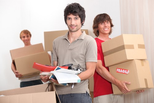 Packed moving boxes and furniture ready for house removals in Sutton