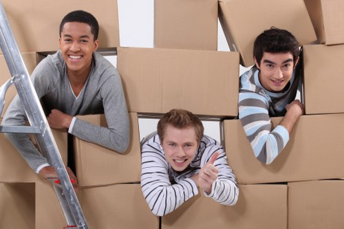 Professional movers handling furniture and boxes for a home relocation