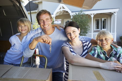 Moving team handling furniture safely during a house move