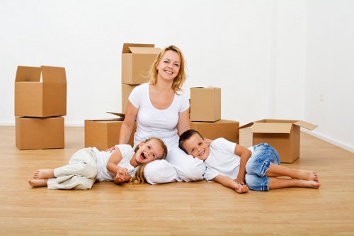 Business furniture and boxes arranged for commercial moves in Sutton